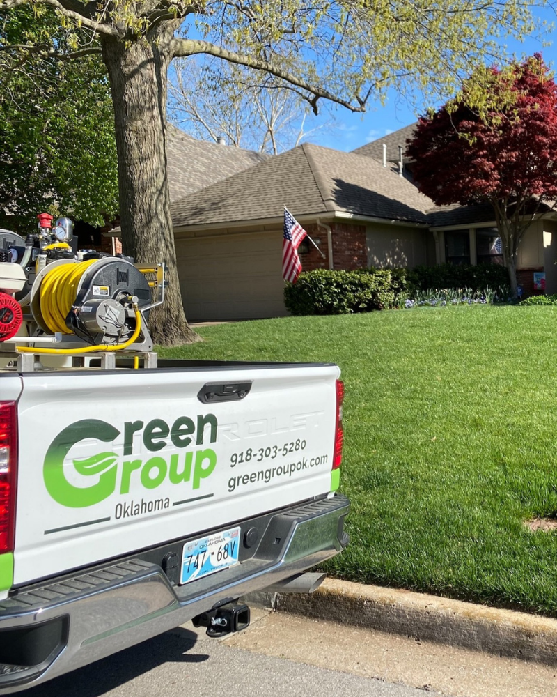 image of a Green Group Oklahoma truck in front of a home with a nice lawn